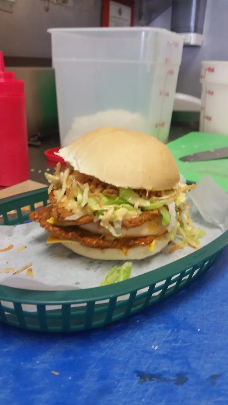 Classic Cuban frita with shoestring potatoes in a basket